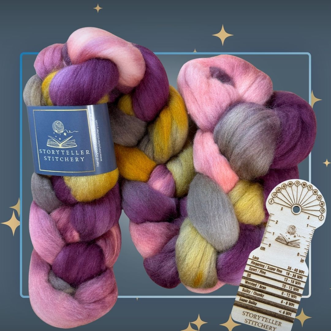 Colorful braid of fiber in shades of gold, brown, pink, and plum, with a wood spinning tool to measure wraps per inch.