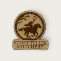 Engraved birch Headless Horseman needle minder with the Storyteller Stitchery name