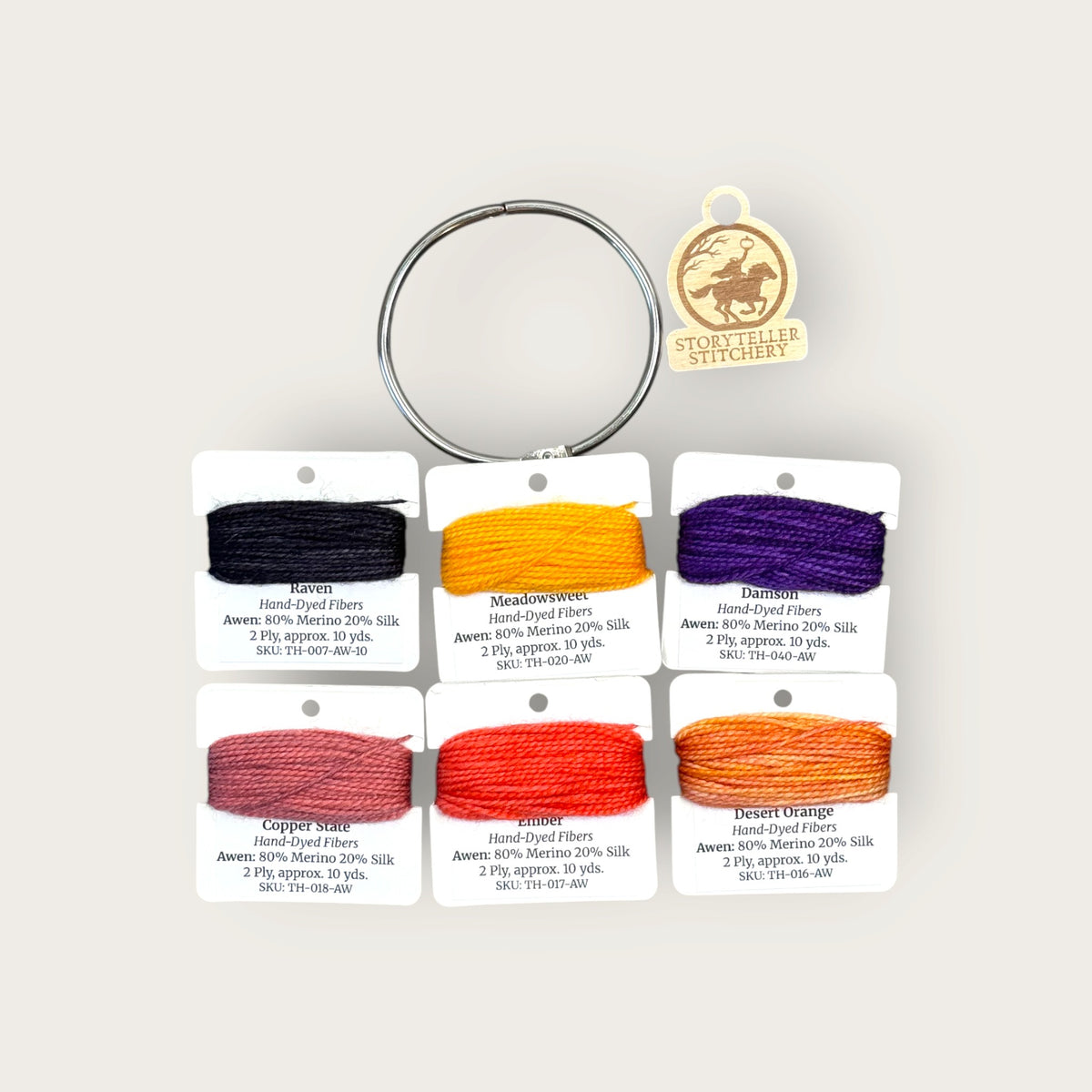 Headless Horseman Thread Set in Awen merino wool-silk: six hand-dyed thread cards in black, gold, purple, orange, and copper