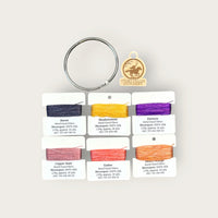 Headless Horseman Thread Set in Moonspun silk: six hand-dyed thread cards in black, gold, purple, orange, and copper