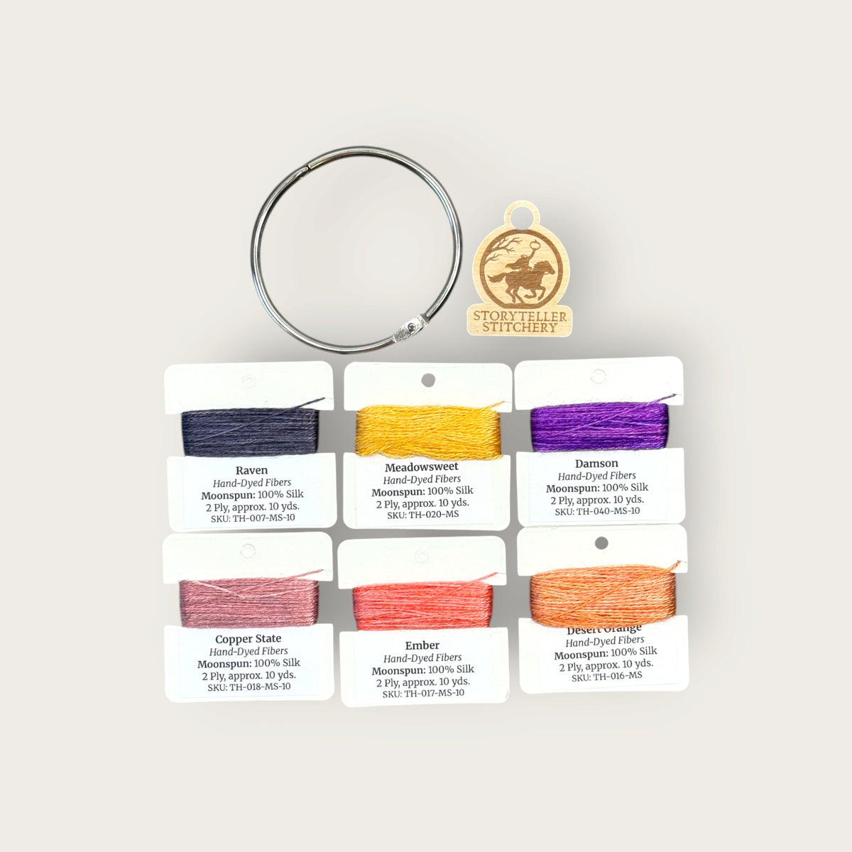 Headless Horseman Thread Set in Moonspun silk: six hand-dyed thread cards in black, gold, purple, orange, and copper