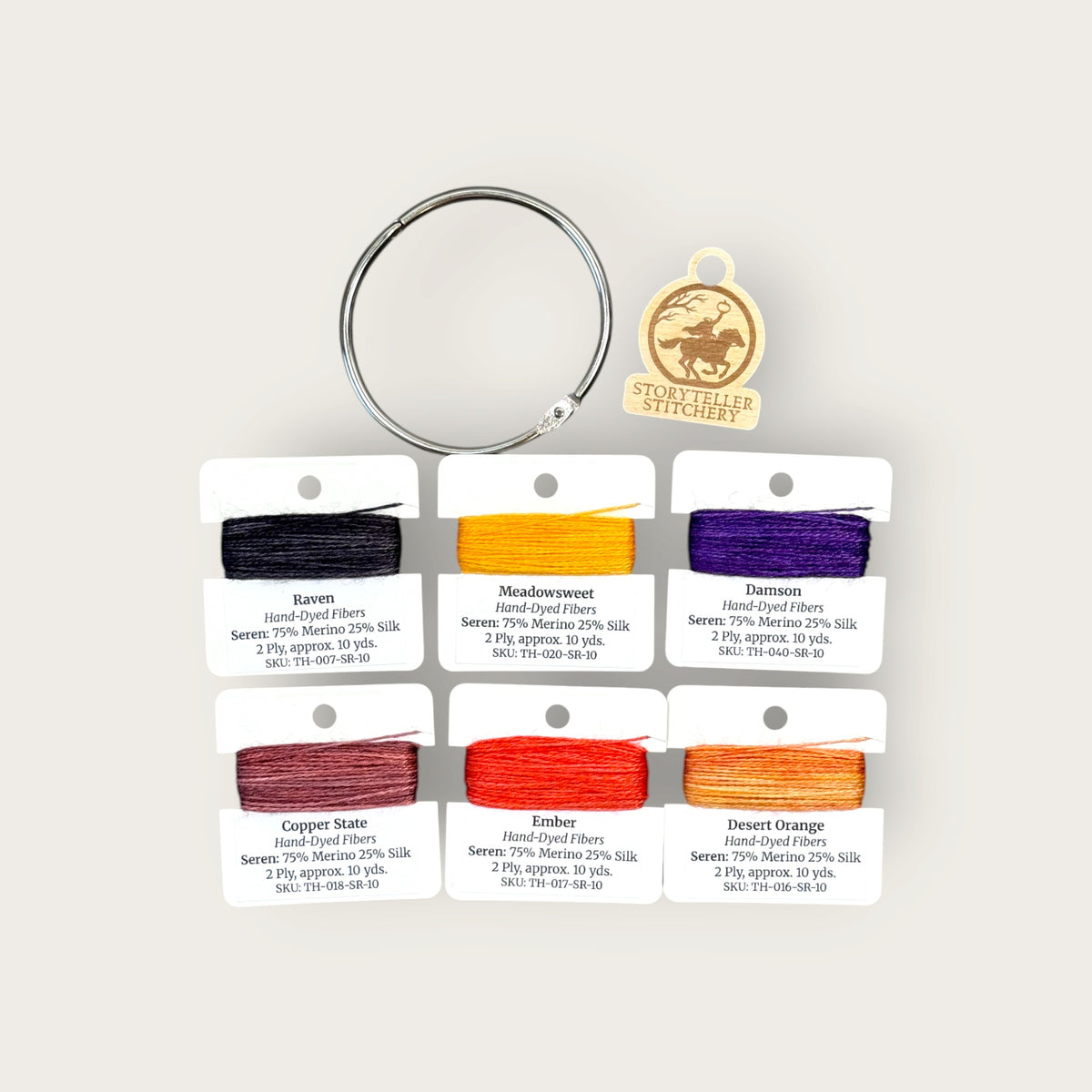 Headless Horseman Thread Set in Seren merino wool-silk: six hand-dyed thread cards in black, gold, purple, orange, and copper