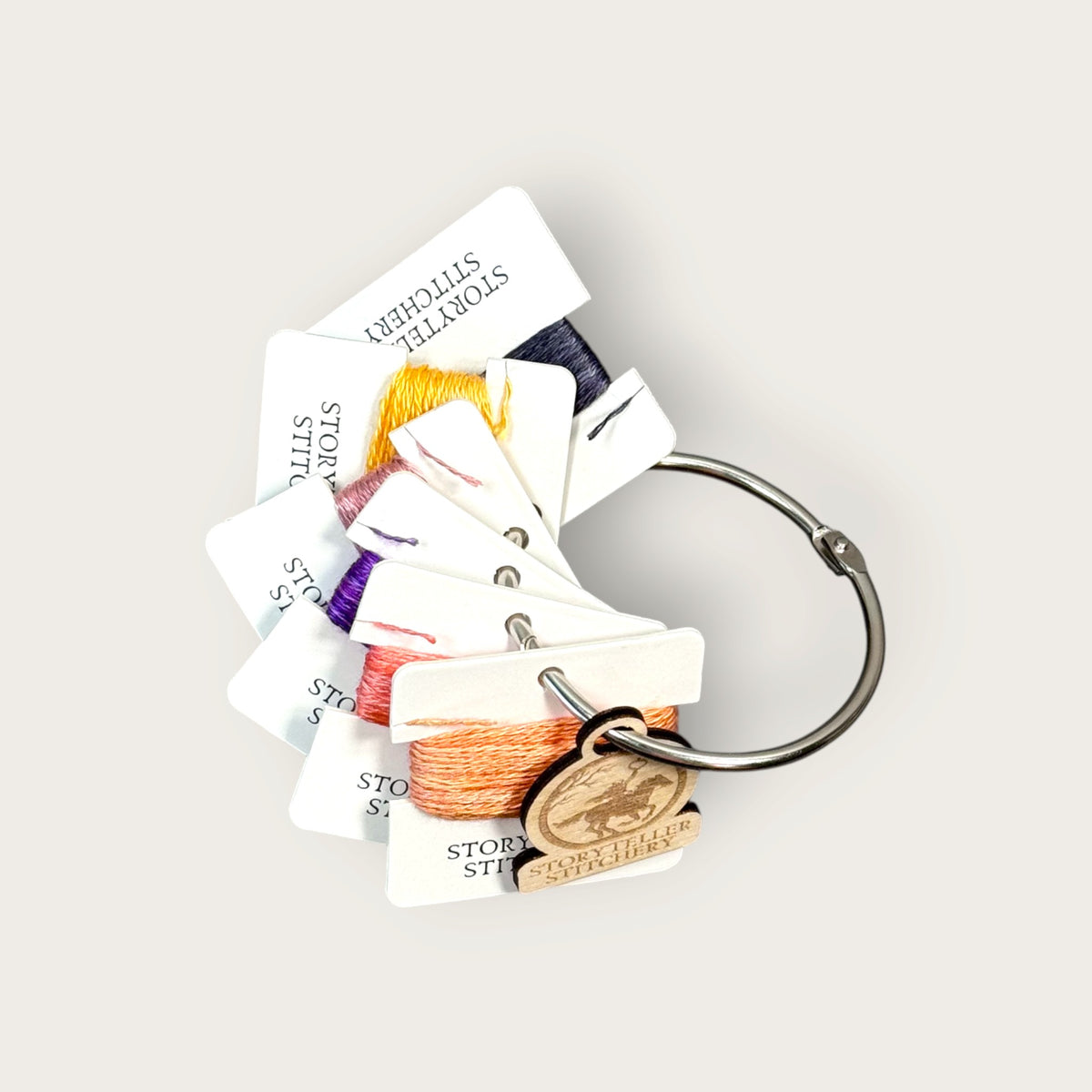 Headless Horseman hand-dyed thread cards in black, purple, gold, orange, and copper with a silver ring and horseman charm