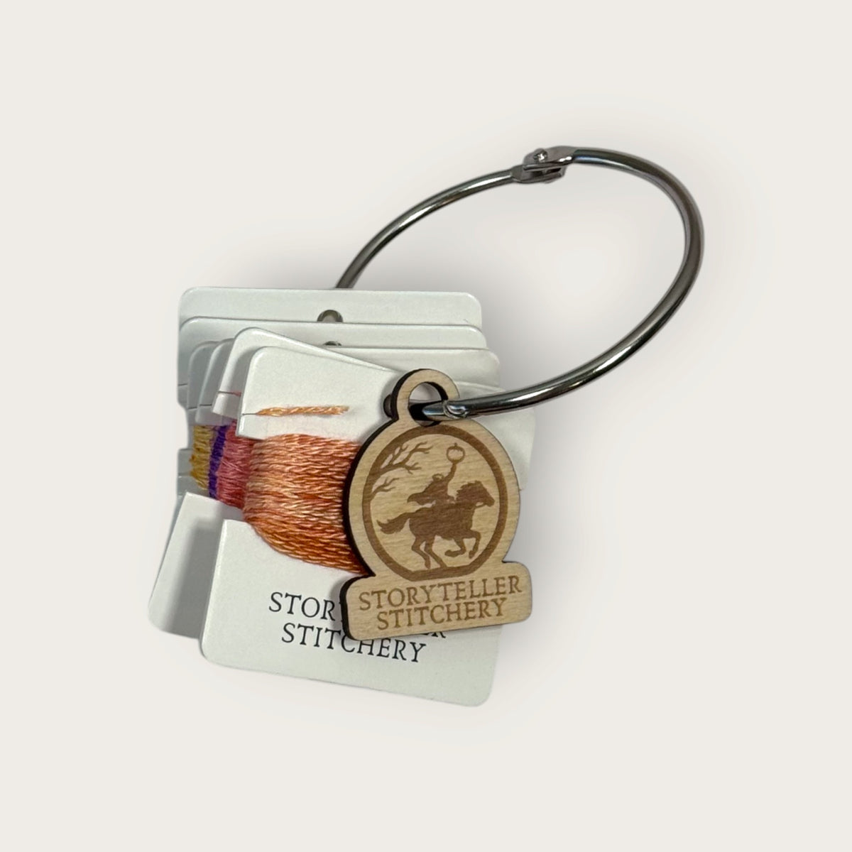 Headless Horseman hand-dyed thread cards in black, purple, gold, orange, and copper with a silver ring and horseman charm