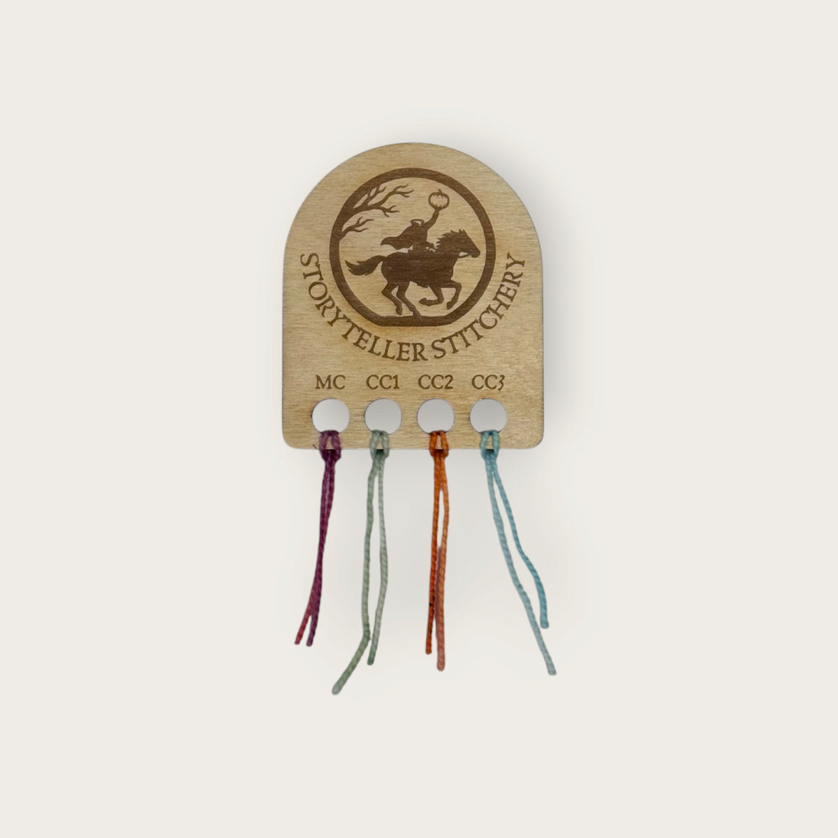 Headless Horseman yarn color organizer with yarn samples looped through each labeled hole