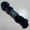 Hand-dyed yarn in deep jewel tones with luminous depth, inspired by The House in the Cerulean Sea by T.J. Klune, shown in Adventure base.
