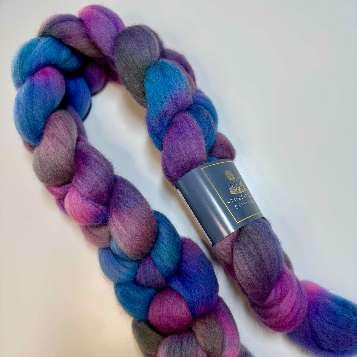 Hand-dyed spinning fiber braid in deep jewel tones with luminous depth, inspired by The House in the Cerulean Sea by T.J. Klune.