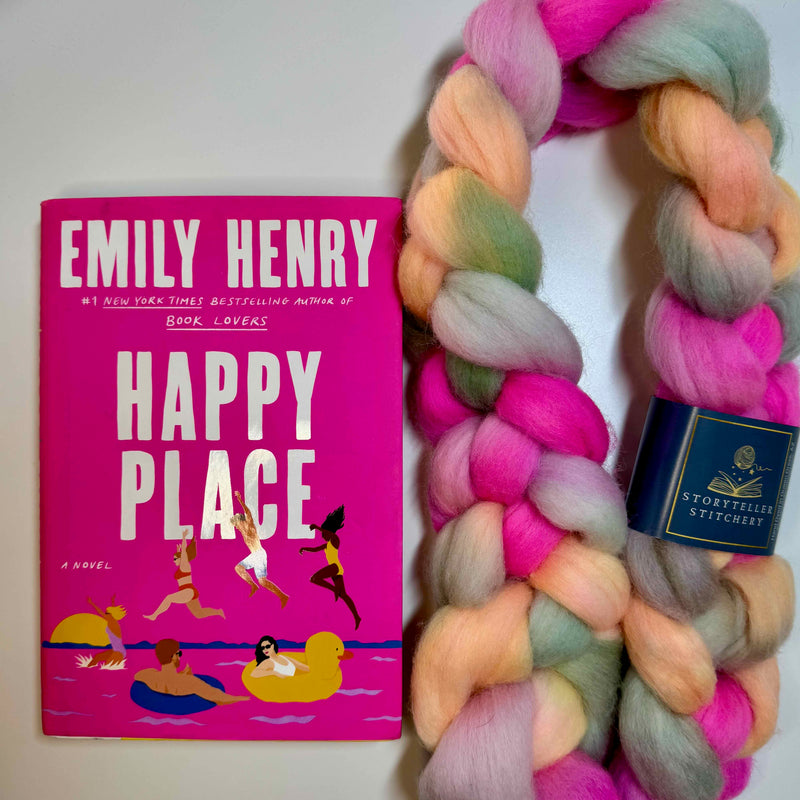 Hand-dyed spinning fiber braid in bright beachy summer colors, inspired by Happy Place by Emily Henry, shown in soft Merino roving alongside the book.