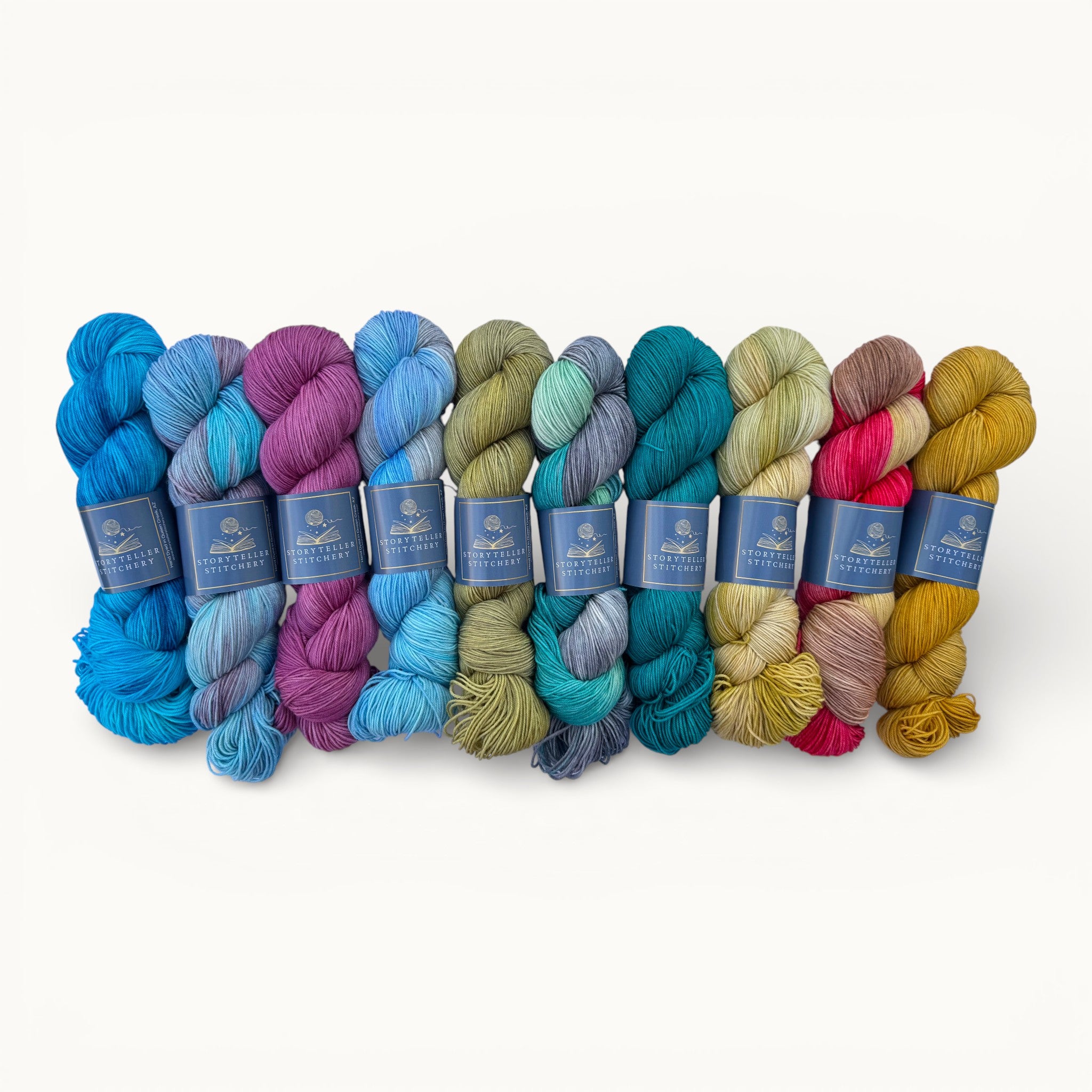 Set of colorful yarn skeins with labels on a white background
